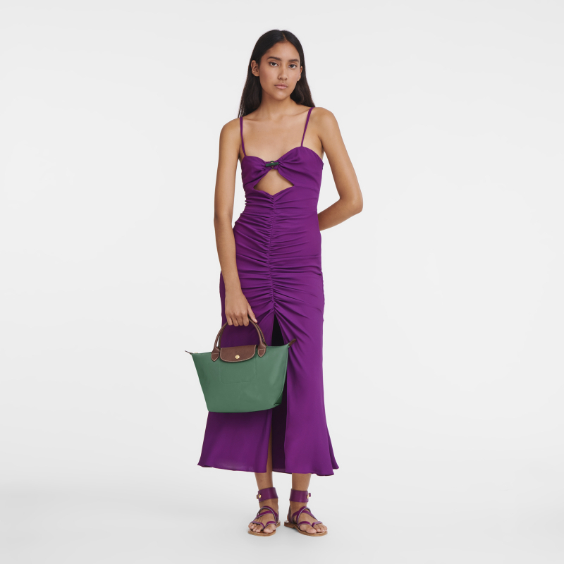 longchamp purple dress Framed by the grandeur of Palais Longchamp, HERA embodies fluid elegance  through sculpted draping, soft lilac chiffon, and refined hand-beaded  details. Paired with matching shawl sleeves, the gown